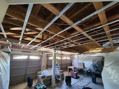 Garage ceiling opened with drying equipment running in Fullerton